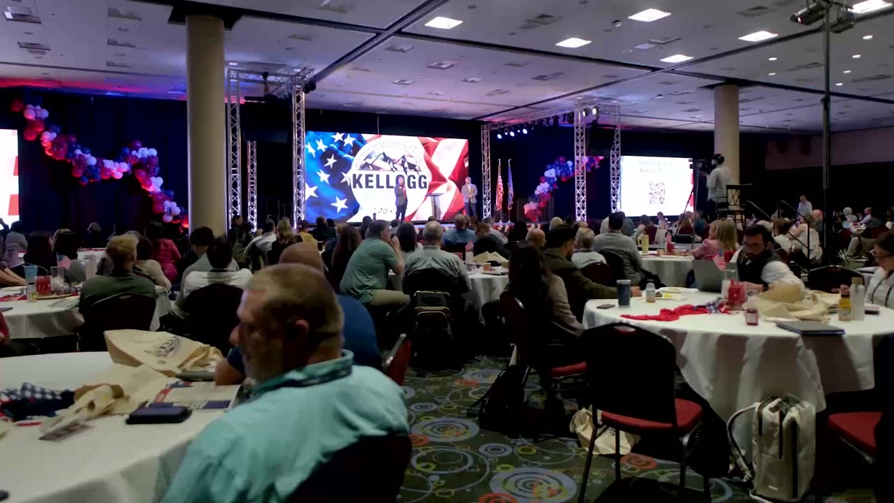 Walking through a seated corporate audience