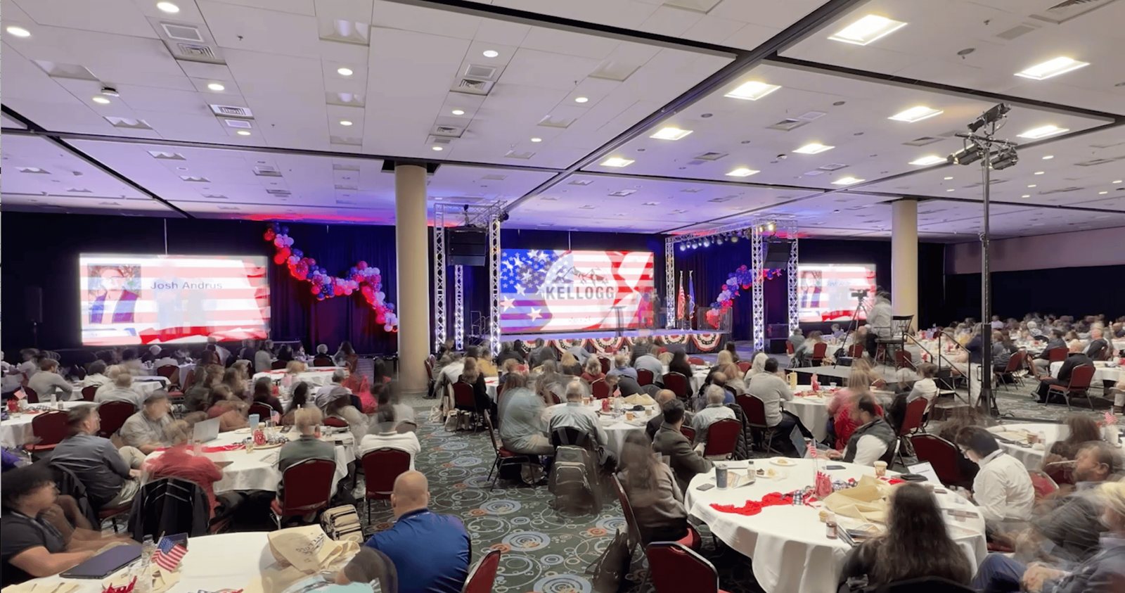 Agents seated across the ballroom during a general session